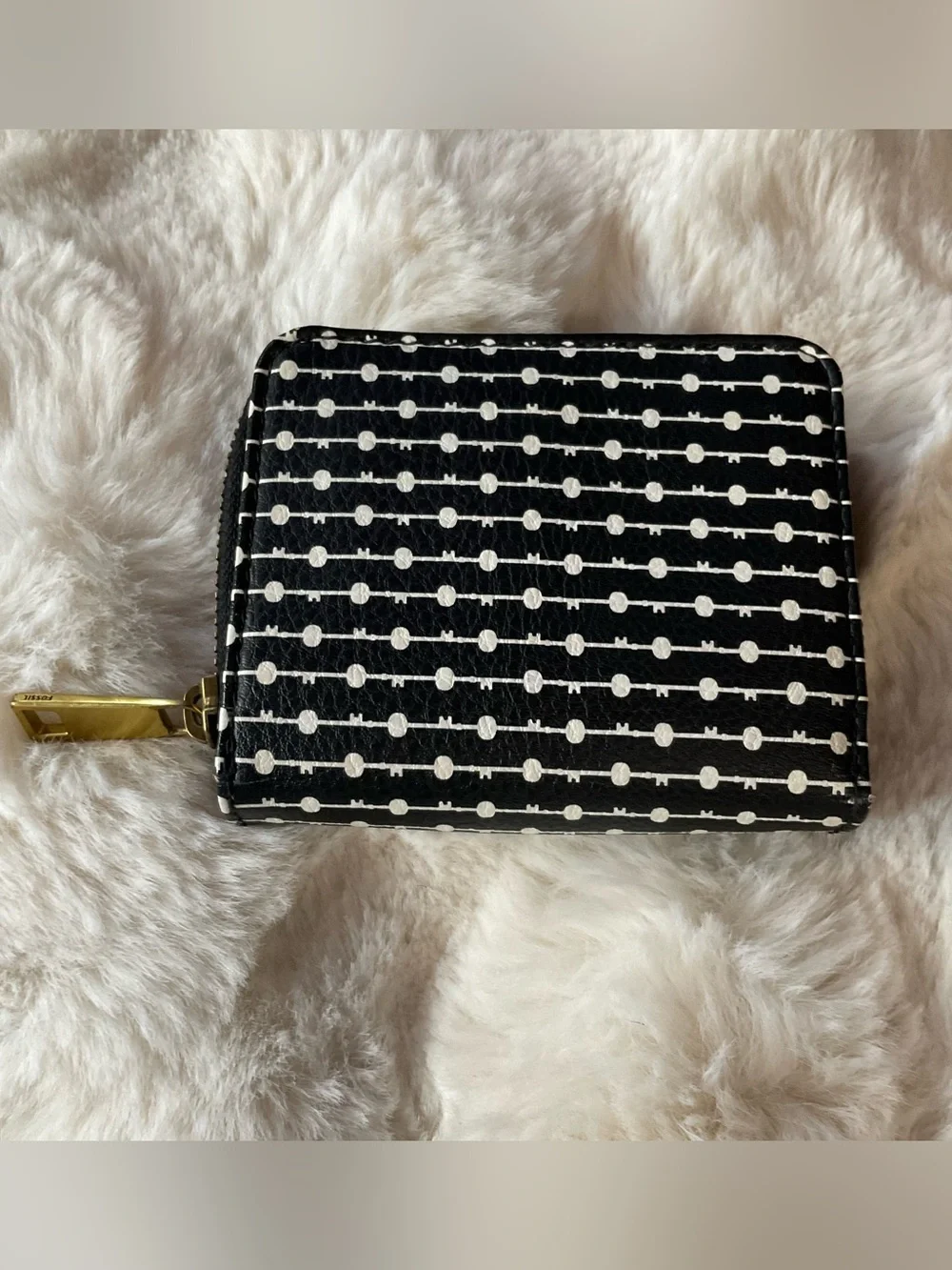 Fossil Logan zip-around bifold wallet, black & white dotted lines, gold hardware